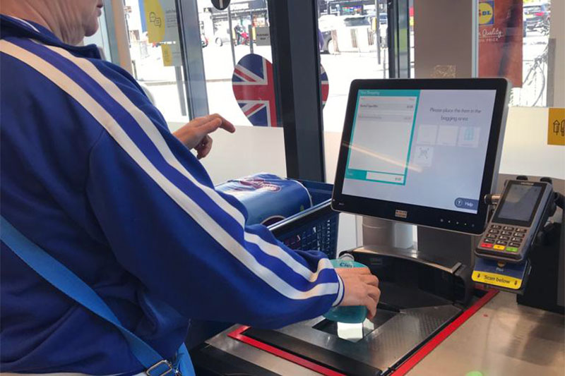 Supported living client paying at a shopping store